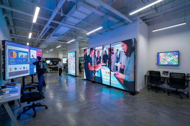 Touch LED display screen applications across venues LED interactive touch screen use cases across an exhibition hall, a retail store and a meeting room with touch LED display screens